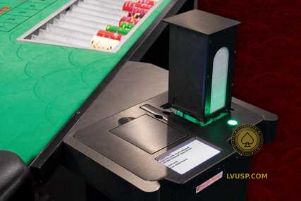 Shuffle Master MD3 installed beside a casino table