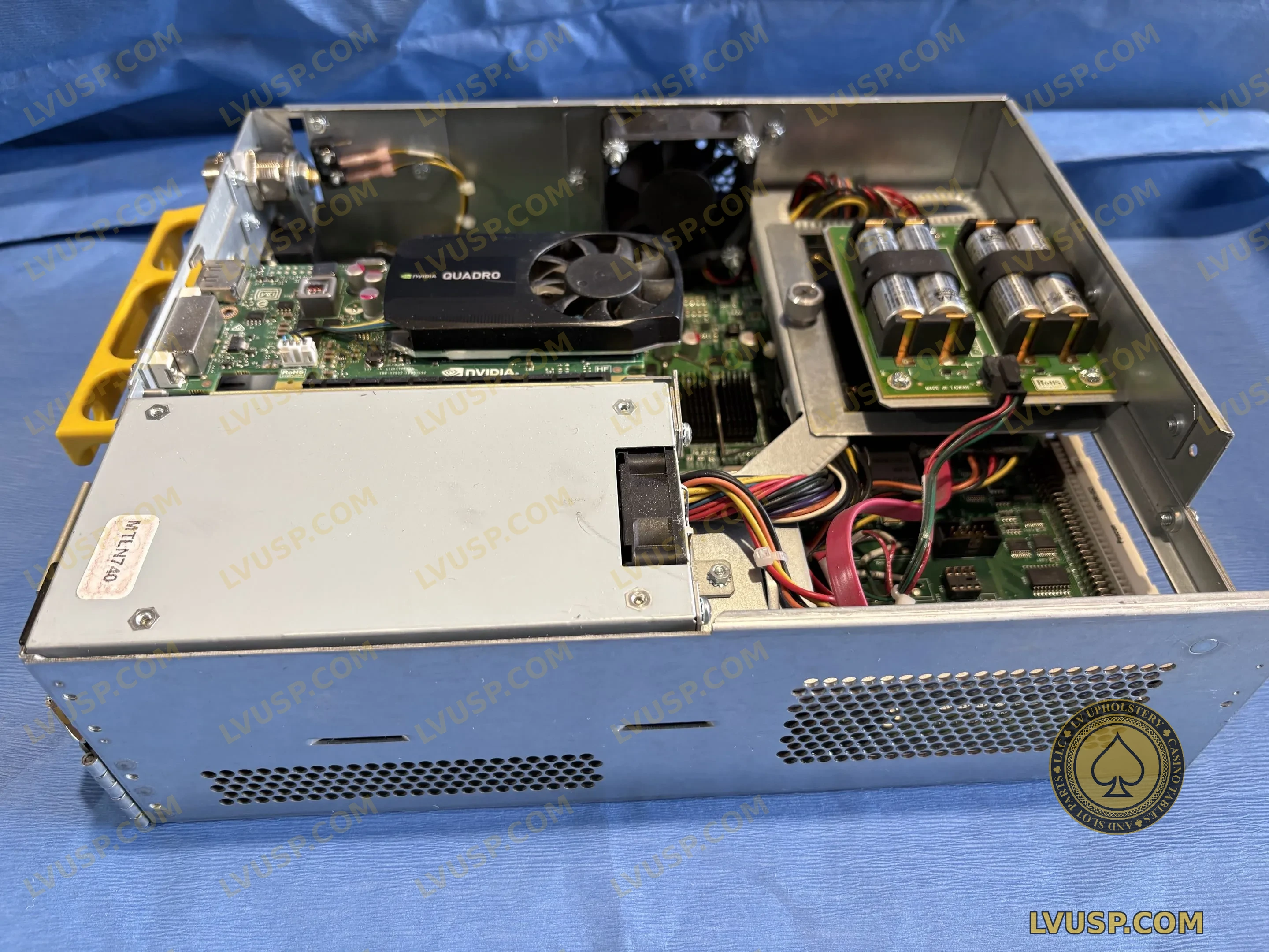 Open slot machine logic cage with NVIDIA Quadro graphics card and internal control electronics